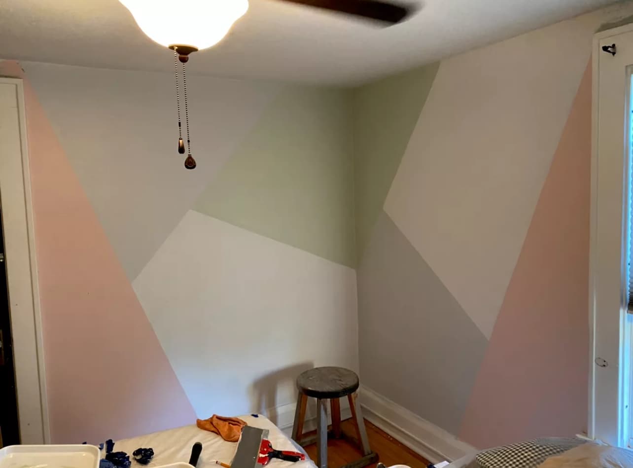 Geometric pastel wall painting with creative interior design