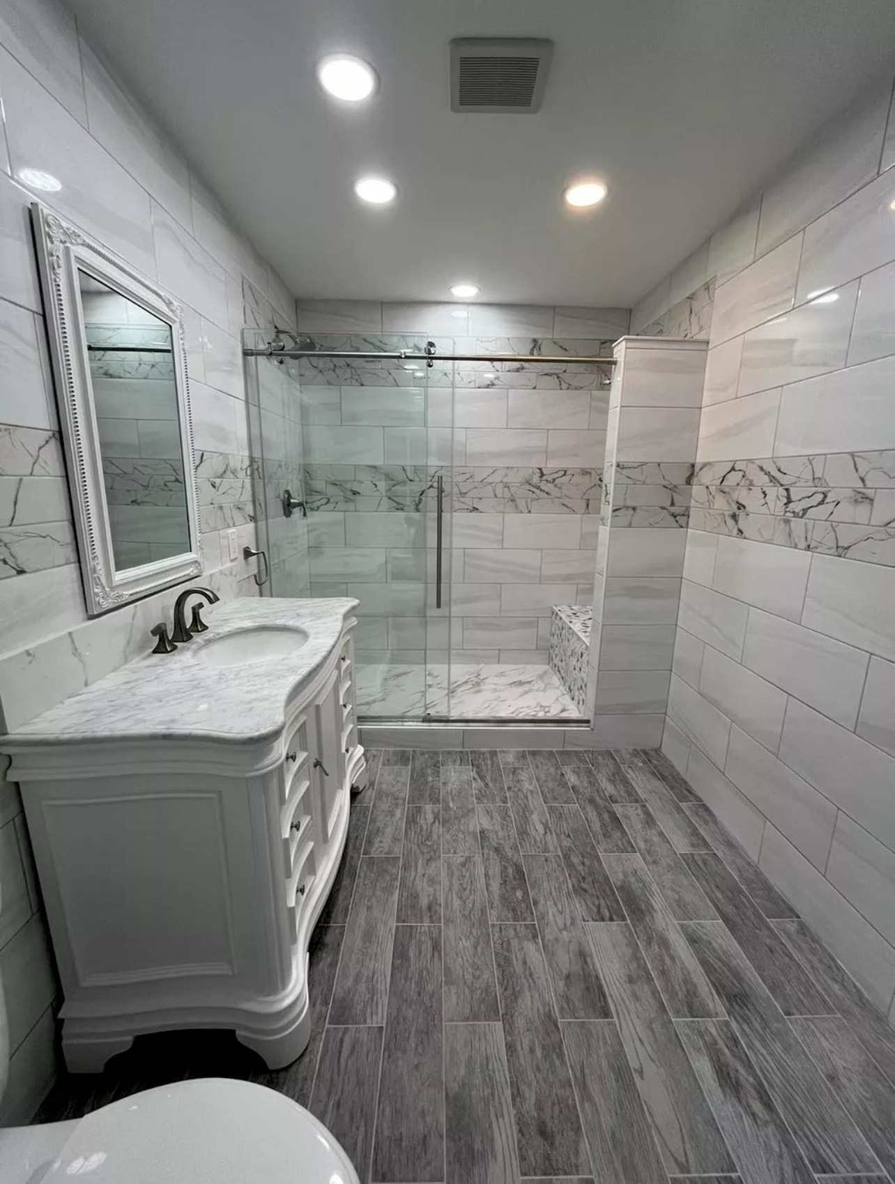 Stunning marble bathroom with professional tile work
